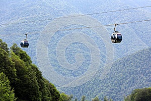 Ski lift on the mountain close-up. Cabin and pillar.