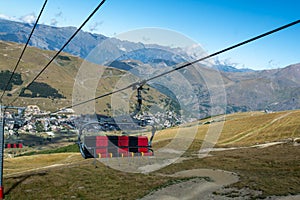 Ski lift near winter and summer sport station Les deux Alpes and view on Alpine mountains peaks in summer, Isere, France photo