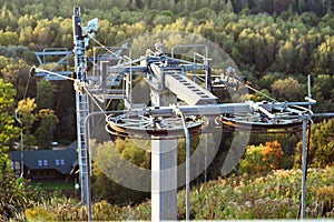 Ski lift off-season autumn. The mechanism of the ski lift. Rotating wheel of elevator. photo