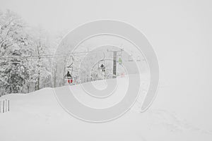 Ski lift over snow mountain in ski resort .