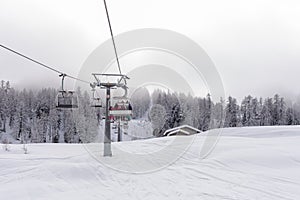 Ski lift with passengers in the chair