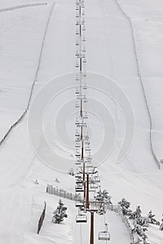 Ski lift and slope. Snow landscape. Winter sport