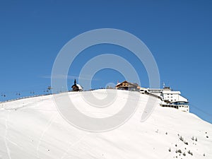 Ski lift on snowy mountain