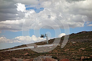 A ski lift at the summit of a mountain pass