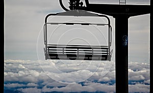 Ski lift suspended above the clouds in Whakapapa ski area, Tongariro National Park, New Zealand