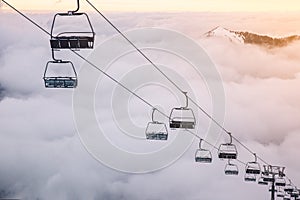 Ski lifts above the clouds