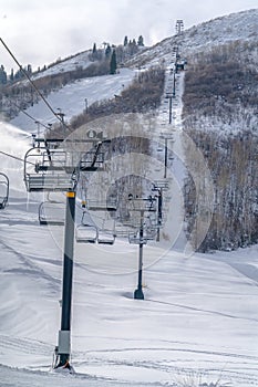 Ski lifts above a mountain ski slope in Park City
