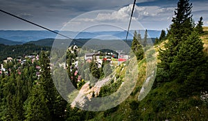 Ski lifts climb the hill