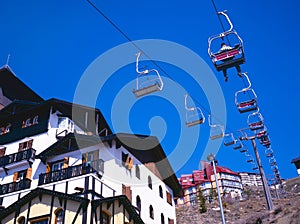 Ski lifts moving up and down photo