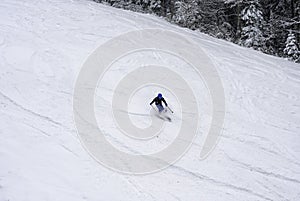 Ski man on slope Skier in high mountains