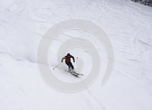 Ski man on slope Skier in high mountains