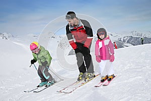 Ski monitor teaching children to ski