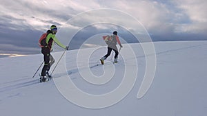 Ski mountaineering couple uphill