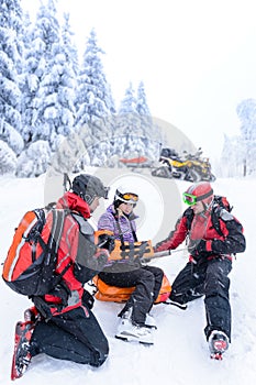 Ski patrol team rescue woman broken arm photo