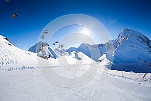 Ski piste panorama with ropeway chair lift