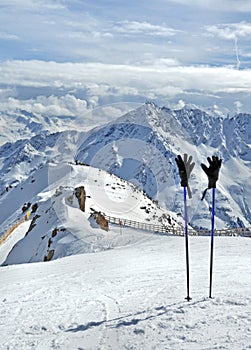 Ski poles and gloves in Alps