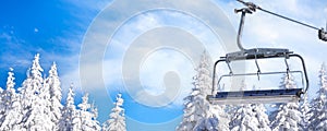 Ski resort, ski lift and snow pine trees