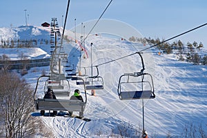 Ski resort in Russia, trails with snow-covered trees and a chairlift