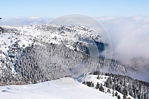 Ski resort, ski lift, mountain view, fog