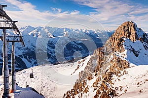 Ski resort in winter Alps mountains, France. View of gondola lift and ski slopes. Meribel, France