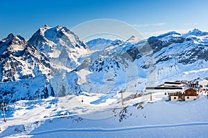 Ski resort in winter Alps mountains, France. View of ski slopes and ski lift. Meribel, France