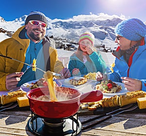 Ski restaurant lunch break with Fondue cheese.