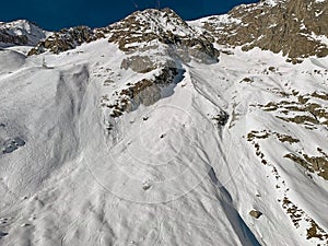 Ski run along the slope in the Mont Blanc massif in the italian Alps at Courmayeur town, Italy photo