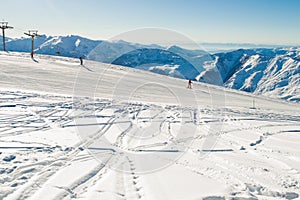 Ski run with amazing view on Caucasus Mountain range. Skiing resort. Extreme sport. Active holiday. Free time, travel concept. Cop