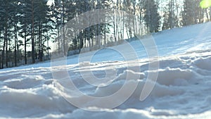 Ski Slope on the Background of the Forest. Legs of a Skier Going up in an Elevator. Ski Boots Close-up