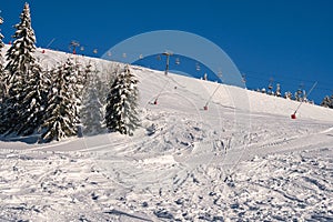 Ski slope with ski cableway on ski resort on Kubinska Hola during winter