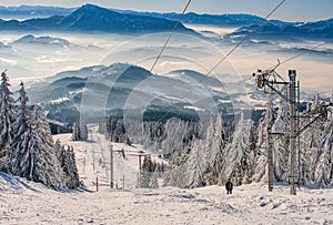 Ski slope with ski lift on ski resort on Kubinska Hola during winter