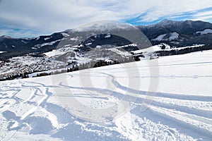 Ski slope with ski tracks