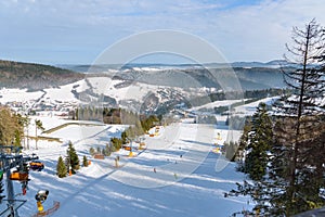 Ski slope at Slotwiny Arena ski station on a sunny day