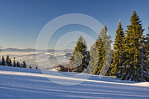 Ski slope of Velka Raca - Oscadnica ski resort and overview to the west