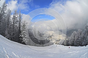 Ski slope (winter mountain landscape)