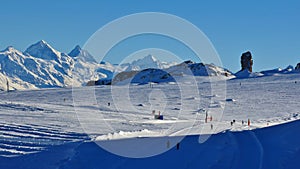 Ski slopes on the Diablerets glacier. Famous rock Quille du Diable. Winter scene in Switzerland.