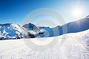 Ski slopes in ski resort in winter Alps