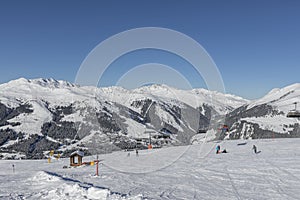 Ski slopes in a skiing resort in tyrol, austria at sunny weather