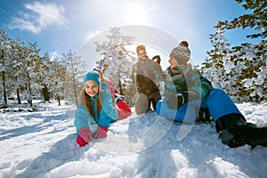 Ski, snow sun and fun - family enjoying winter vacations