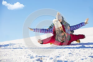 Ski, snow sun and fun - happy family on ski holiday