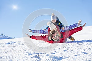 Ski, snow sun and fun - happy family on ski holiday