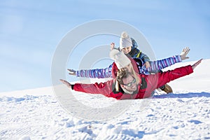 Ski, snow sun and fun - happy family on ski holiday