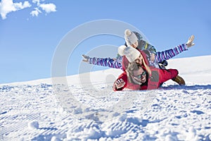 Ski, snow sun and fun - happy family on ski holiday