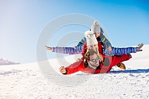 Ski, snow sun and fun - happy family on ski holiday