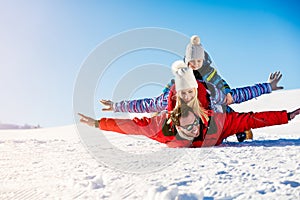 Ski, snow sun and fun - happy family on ski holiday