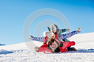 Ski, snow sun and fun - happy family on ski holiday