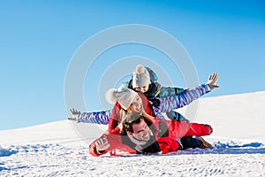 Ski, snow sun and fun - happy family on ski holiday