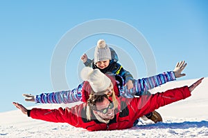 Ski, snow sun and fun - happy family on ski holiday