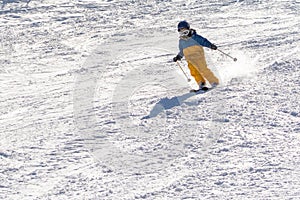 Ski, snow, sun and fun with kids on a snow track,child on ski