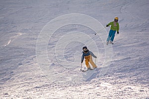 Ski, snow, sun and fun with kids on a snow track,child on ski